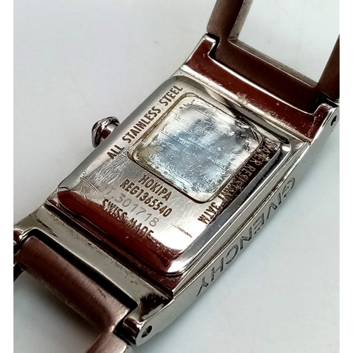 127 - A polished, stainless steel, ladies GIVENCHY-Paris watch, rectangular case 26 x 17 mm, dark blue dia... 