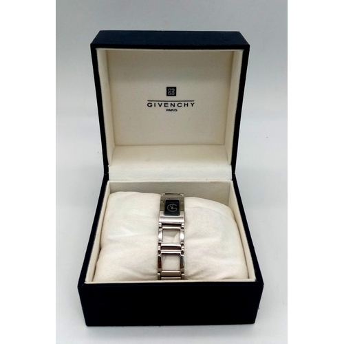 127 - A polished, stainless steel, ladies GIVENCHY-Paris watch, rectangular case 26 x 17 mm, dark blue dia... 