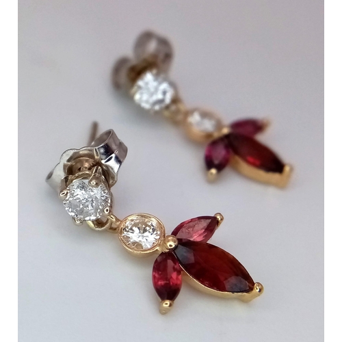 697 - A Pair of 14K Gold, Rhodolite Garnet and Diamond Earrings. 
0.4ctw diamonds.