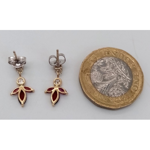 697 - A Pair of 14K Gold, Rhodolite Garnet and Diamond Earrings. 
0.4ctw diamonds.