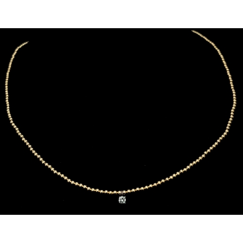 934 - A 14K Yellow Gold Small Bead Necklace with White Stone Diamond Decoration - 0.07ct.  1.5g total weig... 