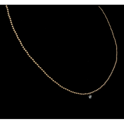 934 - A 14K Yellow Gold Small Bead Necklace with White Stone Diamond Decoration - 0.07ct.  1.5g total weig... 