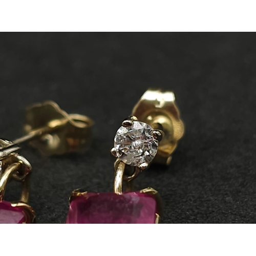 982 - A Pair of 14K Yellow Gold Ruby and Diamond Earrings. 0.24ctw of round cut diamonds. 2ctw of rectangu... 