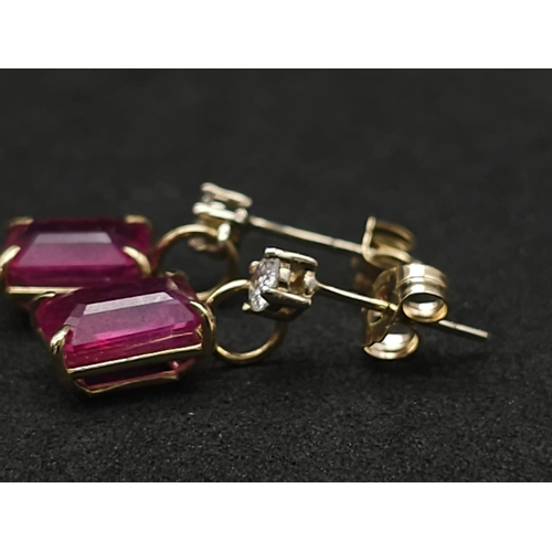 982 - A Pair of 14K Yellow Gold Ruby and Diamond Earrings. 0.24ctw of round cut diamonds. 2ctw of rectangu... 