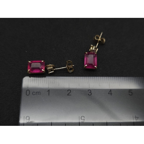 982 - A Pair of 14K Yellow Gold Ruby and Diamond Earrings. 0.24ctw of round cut diamonds. 2ctw of rectangu... 