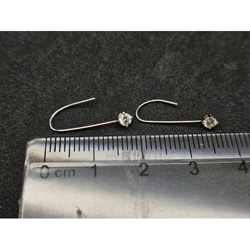 1034 - A Pair of 14K White Gold and Diamond Drop Earrings. 2cm drop. 0.18ctw.