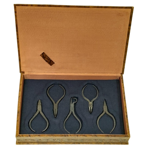 265 - A vintage set of Jeweller’s, handmade, steel pliers, in a beautiful, custom made, embossed fitted ca... 