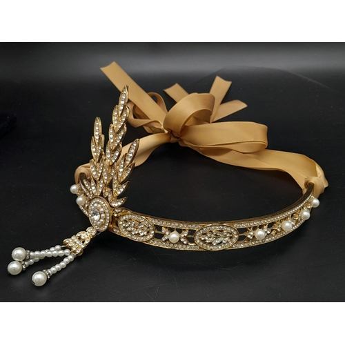 272 - A symbol of 30s “good times”, ART DECO tiara. Gilded with Austrian crystals complete with ribon.