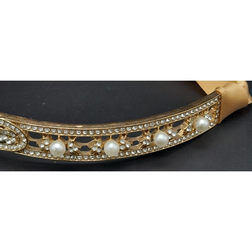 272 - A symbol of 30s “good times”, ART DECO tiara. Gilded with Austrian crystals complete with ribon.