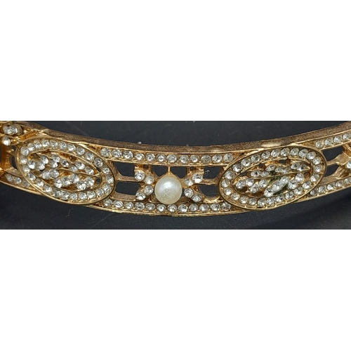 272 - A symbol of 30s “good times”, ART DECO tiara. Gilded with Austrian crystals complete with ribon.