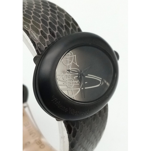 437 - A Vivienne Oval Quartz Ladies Watch. Black leather strap. Case -34mm. As new with tag. In working or... 