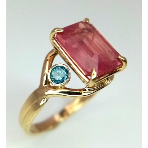 849 - A 14K Yellow Gold, Kunzite and Blue Diamond Ring. 0.14ctw diamond. Size J. 2.3g total weight.