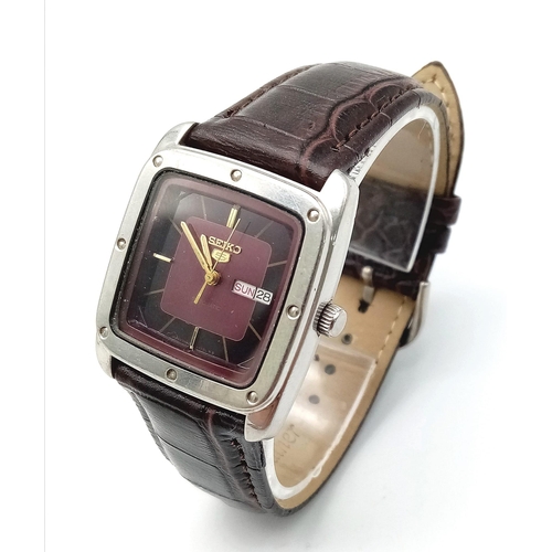 965 - A Vintage Seiko 5 Automatic Gents Watch. Burgundy leather strap. Tank case - 29mm width. Two tone di... 