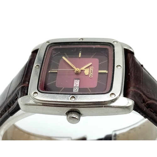 965 - A Vintage Seiko 5 Automatic Gents Watch. Burgundy leather strap. Tank case - 29mm width. Two tone di... 