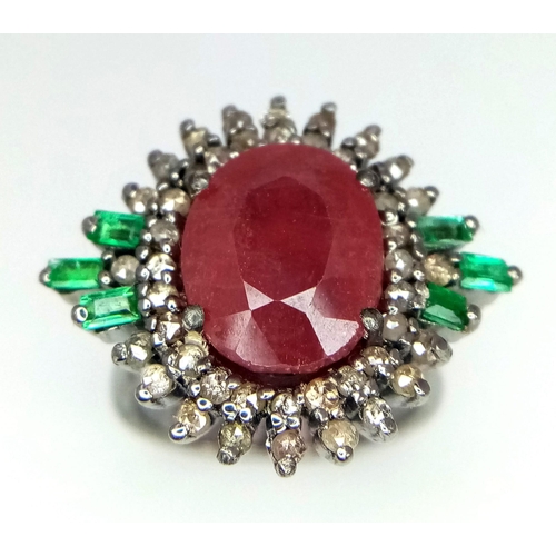 1108 - A Ruby Ring with Diamond Surround and Baguette Cut Emerald Accents, on 925 Silver. Ring size L. 5.25... 