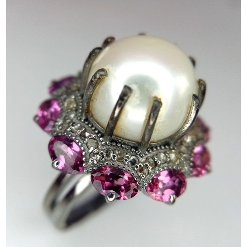 1130 - A Freshwater Pearl Ring with Diamond and Rhodolite Surround. 925 silver. Size M. 12ct pearl, 3ctw rh... 