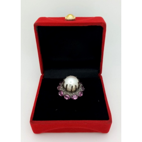 1130 - A Freshwater Pearl Ring with Diamond and Rhodolite Surround. 925 silver. Size M. 12ct pearl, 3ctw rh... 