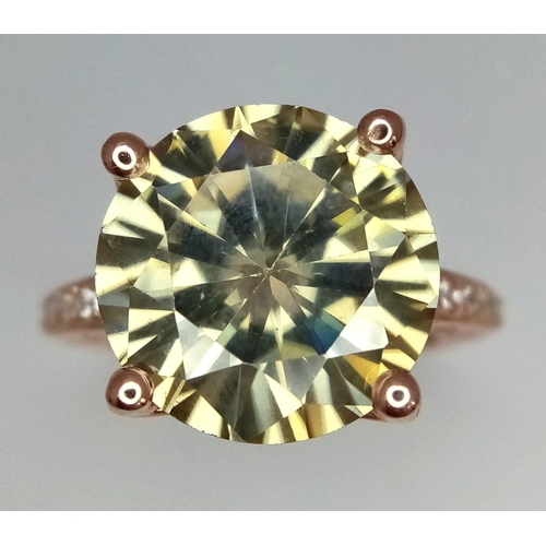 1137 - An 8.80ct Dazzling Round Cut Moissanite Ring Set in Rose Gold Gilded 925 Silver. Size N/O, 5.95g tot... 