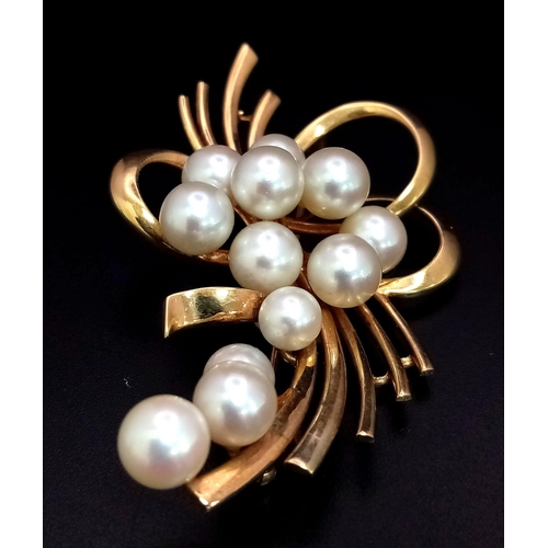 207 - 14k yellow gold cultured pearl brooch with 13 cultured pearls varying from 5mm-8mm. 14.9g weight.