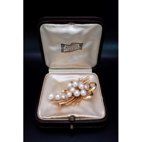 207 - 14k yellow gold cultured pearl brooch with 13 cultured pearls varying from 5mm-8mm. 14.9g weight.