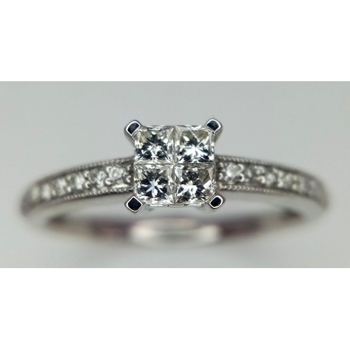 498 - A 9k white gold diamond cluster ring. 1.8g weight. Size L.(dia:0.40ct)