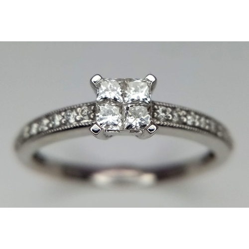 498 - A 9k white gold diamond cluster ring. 1.8g weight. Size L.(dia:0.40ct)