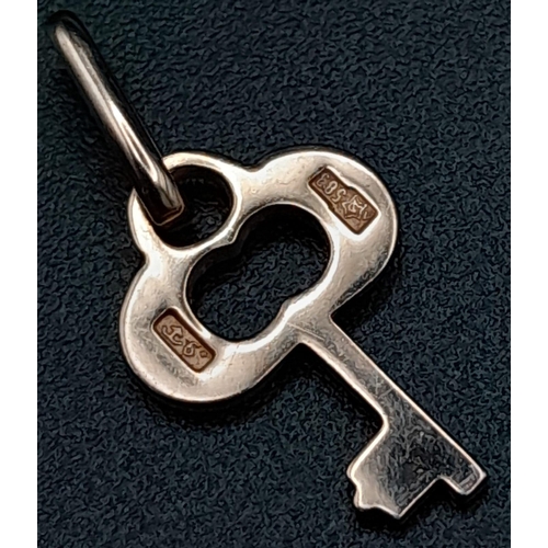 1070 - 14K ROSE GOLD KEY CHARM. TOTAL WEIGHT 0.8G