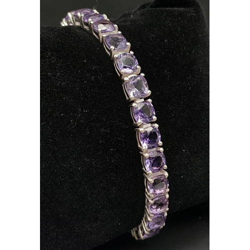 1122 - Round Faceted Brazilian Amethyst Tennis Bracelet on 925 Silver. 19cm in length, 20g total weight.