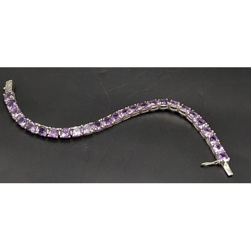 1122 - Round Faceted Brazilian Amethyst Tennis Bracelet on 925 Silver. 19cm in length, 20g total weight.