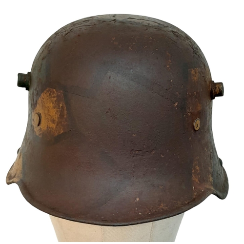 131 - A WW1 Imperial German M17 Jigsaw pattern camouflage Stahlhelm with liner.