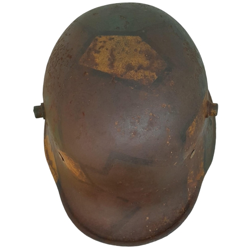 131 - A WW1 Imperial German M17 Jigsaw pattern camouflage Stahlhelm with liner.