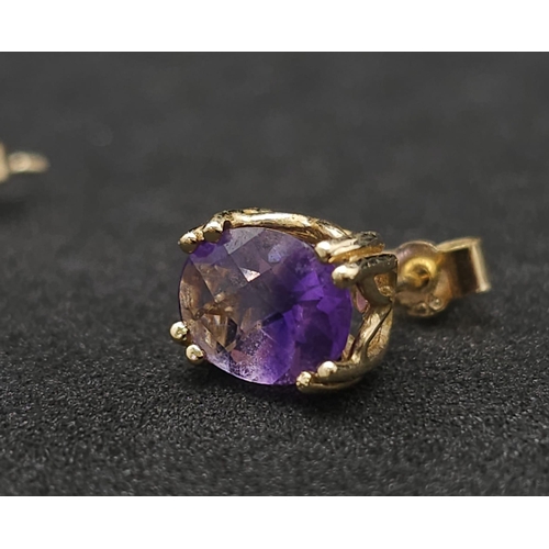 1023 - A pair of 9k yellow gold amethyst earrings. 1.8g total weight.(amethyst: 2.50ct total)