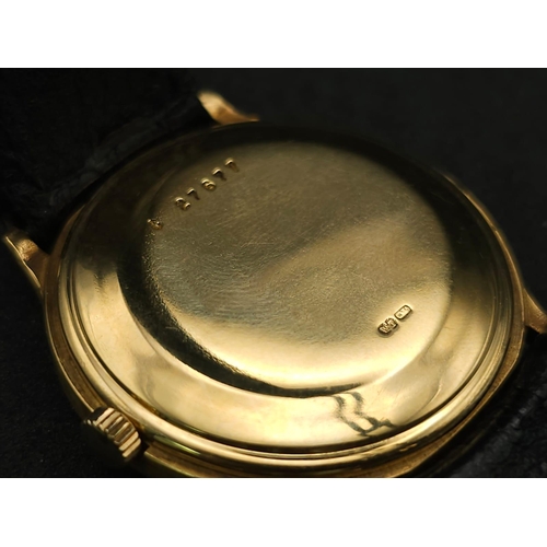 183 - An Audemars Piguet 18K Gold Automatic Moon-Phase Watch. 
Original black leather strap and 18k gold c... 