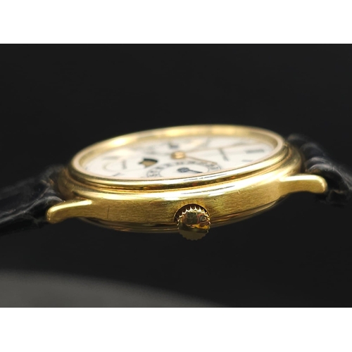 183 - An Audemars Piguet 18K Gold Automatic Moon-Phase Watch. 
Original black leather strap and 18k gold c... 