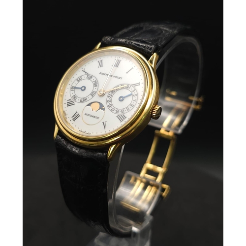 183 - An Audemars Piguet 18K Gold Automatic Moon-Phase Watch. 
Original black leather strap and 18k gold c... 