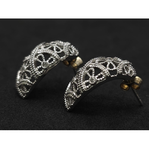 242 - 14kt White Gold Diamond Earrings.
W: 6.2g