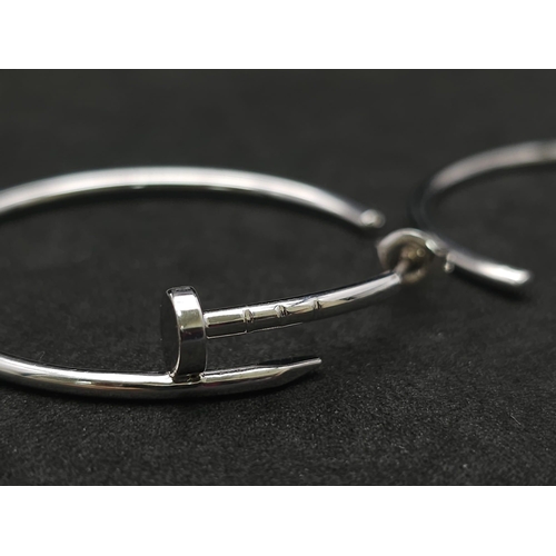 370 - A Pair of 9K White Gold Screw Hoop Earrings in a Cartier Style. 4cm diameter. 9.1g total weight.