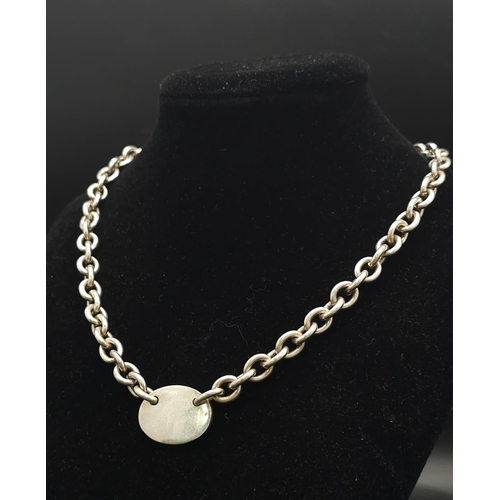 533 - A Sterling silver chunky belcher chain with oval ID tag and t-bar fastening. 57.9g weight. 42cm.