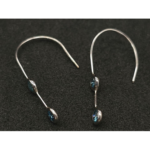 563 - A Pair of Blue Diamond Drop Earrings. 0.28ctw.