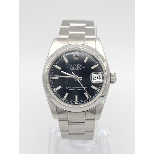 625 - A Rolex Oyster Perpetual Datejust Midsize Watch. Stainless steel bracelet and case - 31mm. Black dia... 