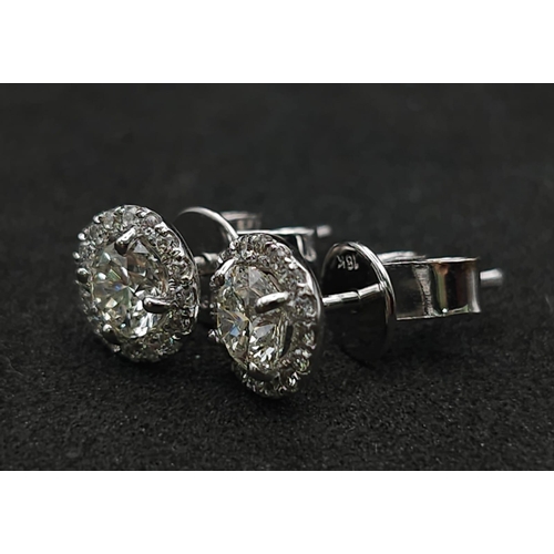 632 - A Stunning Pair of VS2 0.40ct (each) Diamond Stud Earrings. Two gorgeous diamonds with diamond halos... 