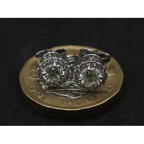 632 - A Stunning Pair of VS2 0.40ct (each) Diamond Stud Earrings. Two gorgeous diamonds with diamond halos... 