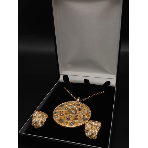 639 - A Theodores 18K Rose Gold and Diamond Circular Pendant on an 18K Rose Gold Chain. 16ctw of rough cut... 