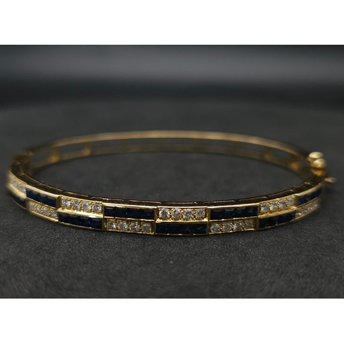 76 - An18kt Yellow Gold Diamond & Sapphire Bangle.0.50ct Diamonds 0.65ct Sapphires 
W: 13.7g