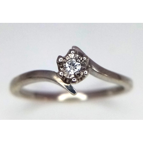 1045 - A 9k white gold diamond ring. 1.9g total weight. Size M. (dia:0.05ct)