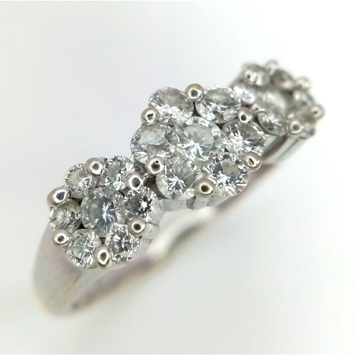 118 - AN 18K WHITE GOLD DIAMOND TRIPLE CLUSTER RING WITH APPROX 0.60CT DIAMONDS IN FLORAL DESIGN, WEIGHT 3... 