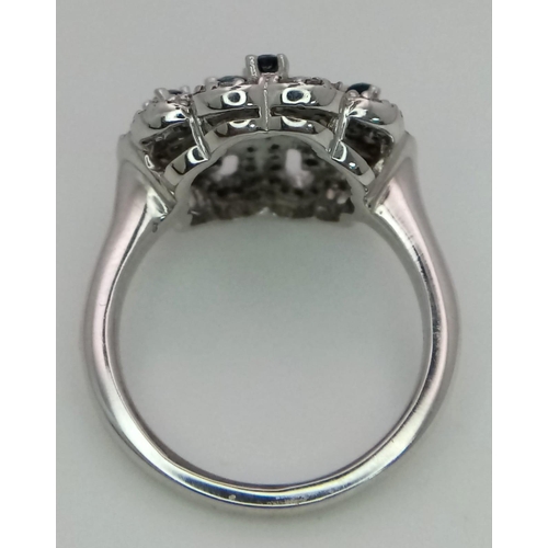 271 - 10K WHITE GOLD DIAMOND SET FANCY RING FLORAL DESIGN, WEIGHT 6G SIZE N