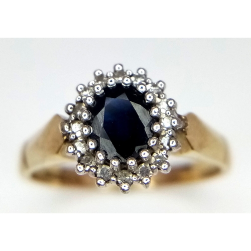 356 - A 9k yellow gold diamond and sapphire ring. 3.3g total weight. Size O (sapp:0.60ct/dia:0.16ct)