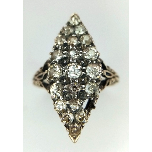 527 - An Antique (Possibly Georgian) 18K Gold and Diamond Ring. An oval cluster of old cut diamonds (one m... 