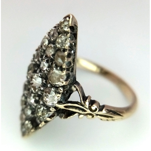 527 - An Antique (Possibly Georgian) 18K Gold and Diamond Ring. An oval cluster of old cut diamonds (one m... 